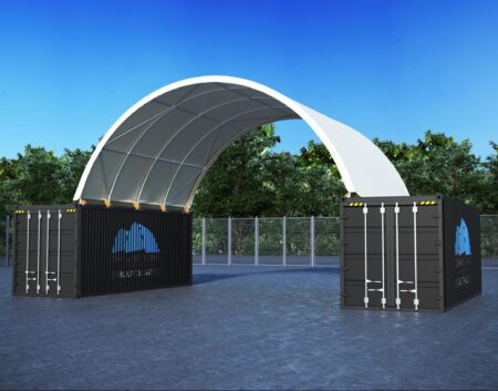 container dome shelter sitting over 2 shipping containers